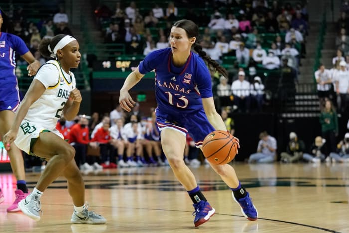 Feb 26, 2022; Waco, Texas, USA; Kansas Jayhawks guard Holly Kersgieter (13) drives to the basket against Baylor Lady Bears guard Ja'Mee Asberry (21) during the first half at Ferrell Center. Mandatory Credit: Chris Jones-USA TODAY Sports